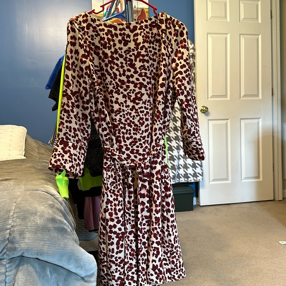 Silky but nice material. With fabric belt
